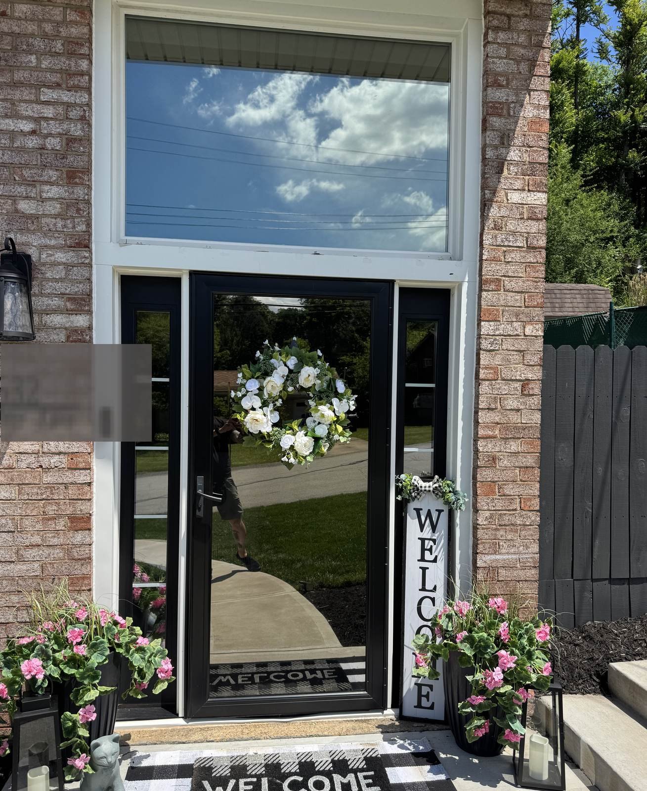Front door sidelights and transom with reflective solar privacy film